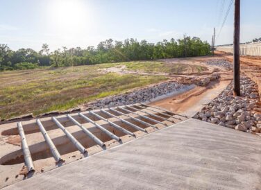 drainage tunels and rocks next to SH 249 Tomball Tollway